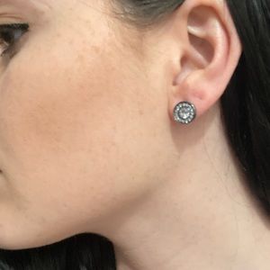 Dark grey w/ small gems circling the middle jewel